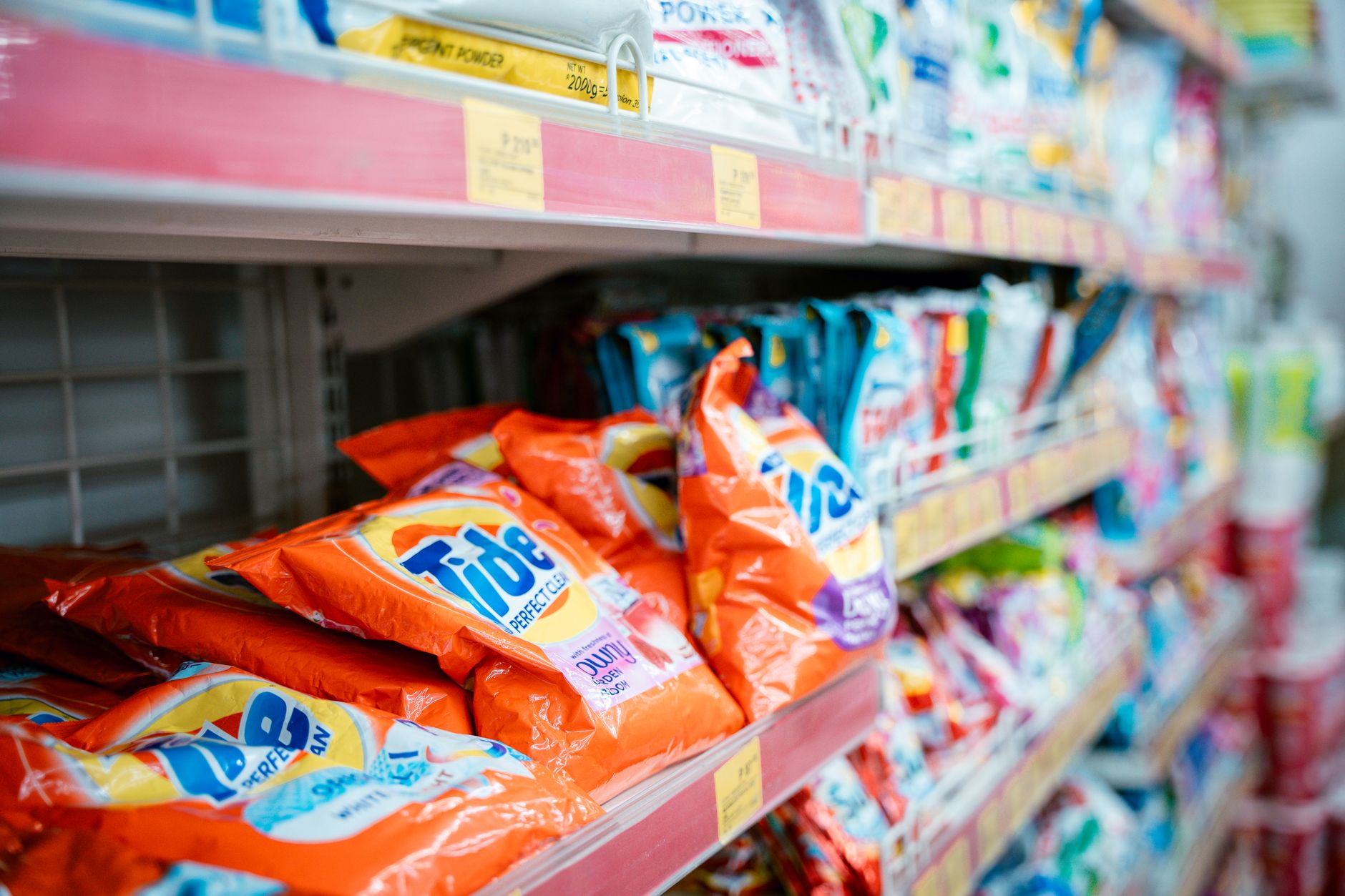 laundry detergent on shelf in supermarket